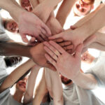 Compassionate Addiction Treatment in Berlin, NJ. Image - Group of people with their palms together