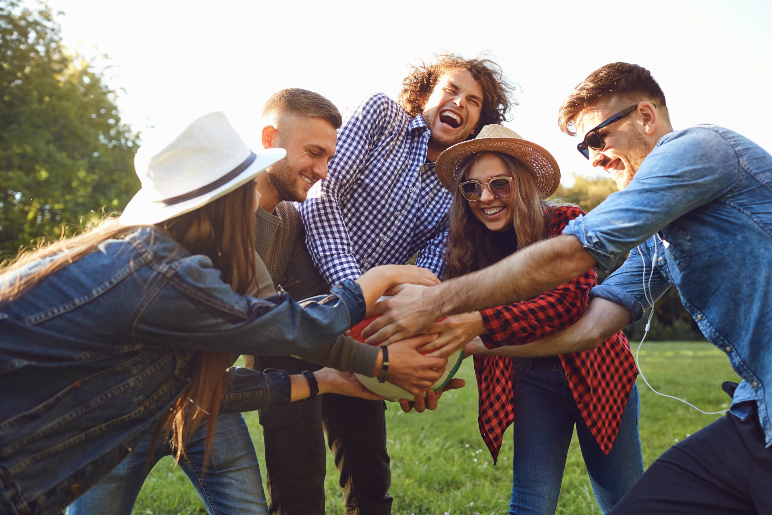 friends playing ball outdoors during an outpatient program session