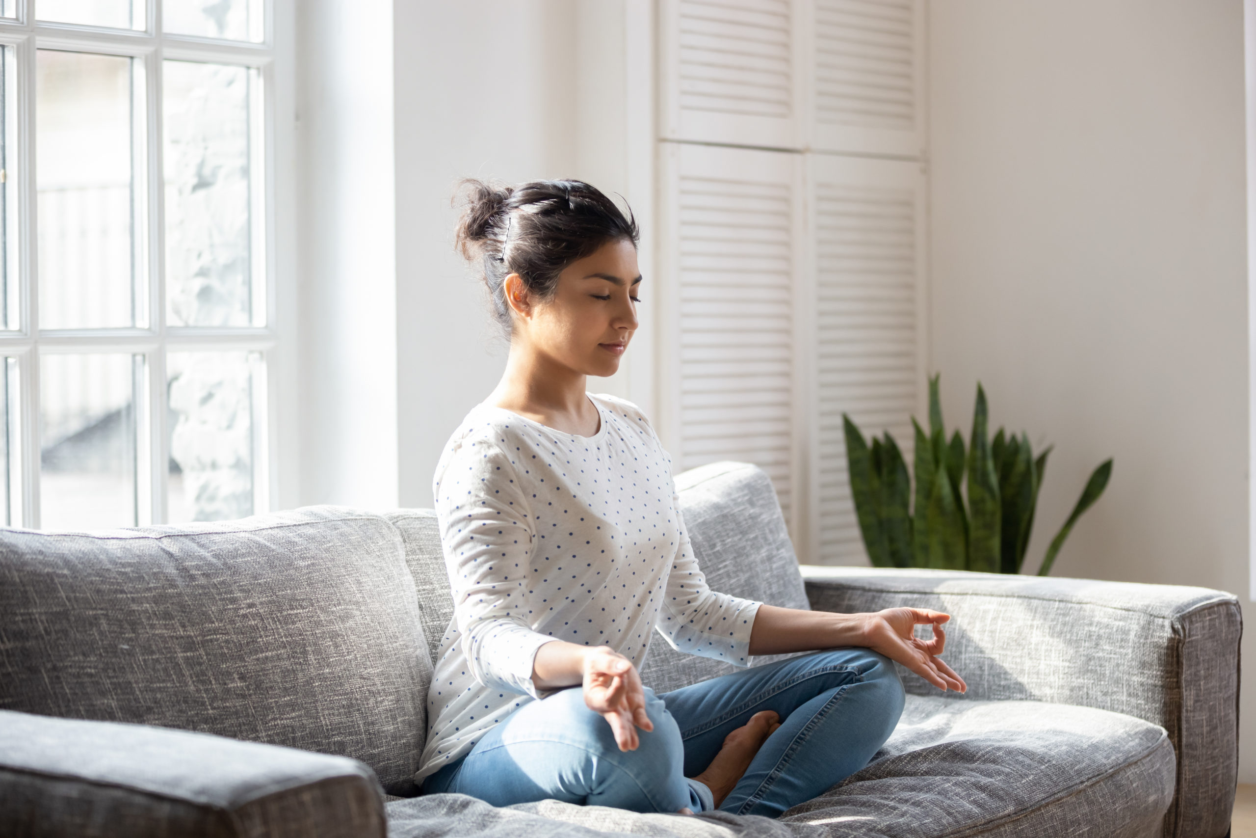 girl meditating as part of a holistic treatment program