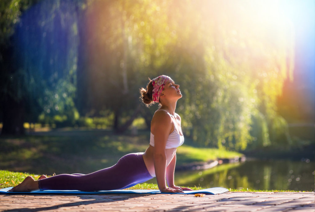 Holistic addiction treatment - Image: Young woman doing yoga - Liberty Wellness