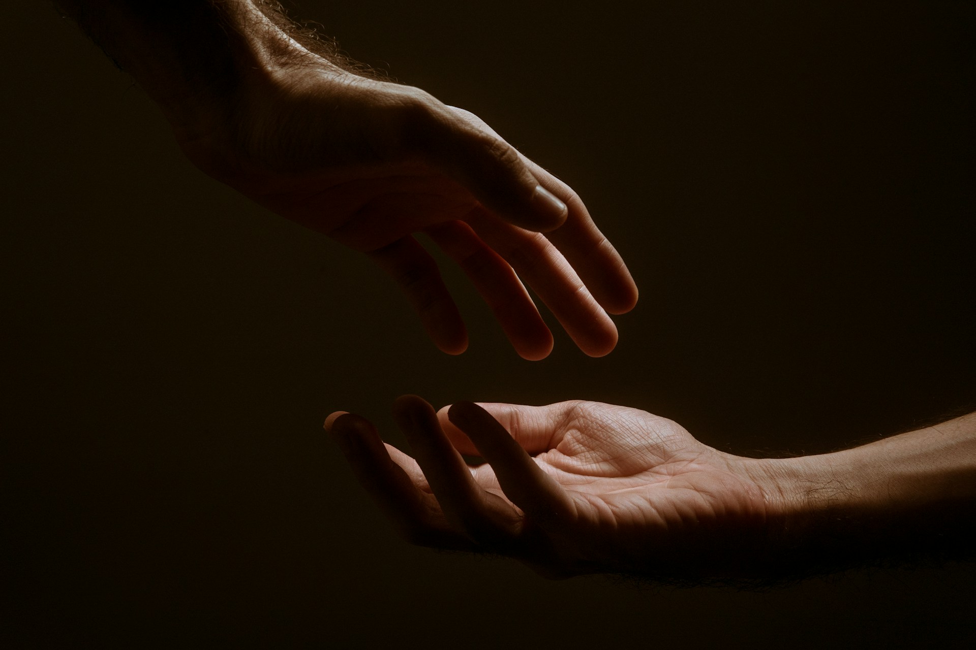 10 Tips for Helping Someone on the Path to Sobriety. Image - 2 hands helping each other