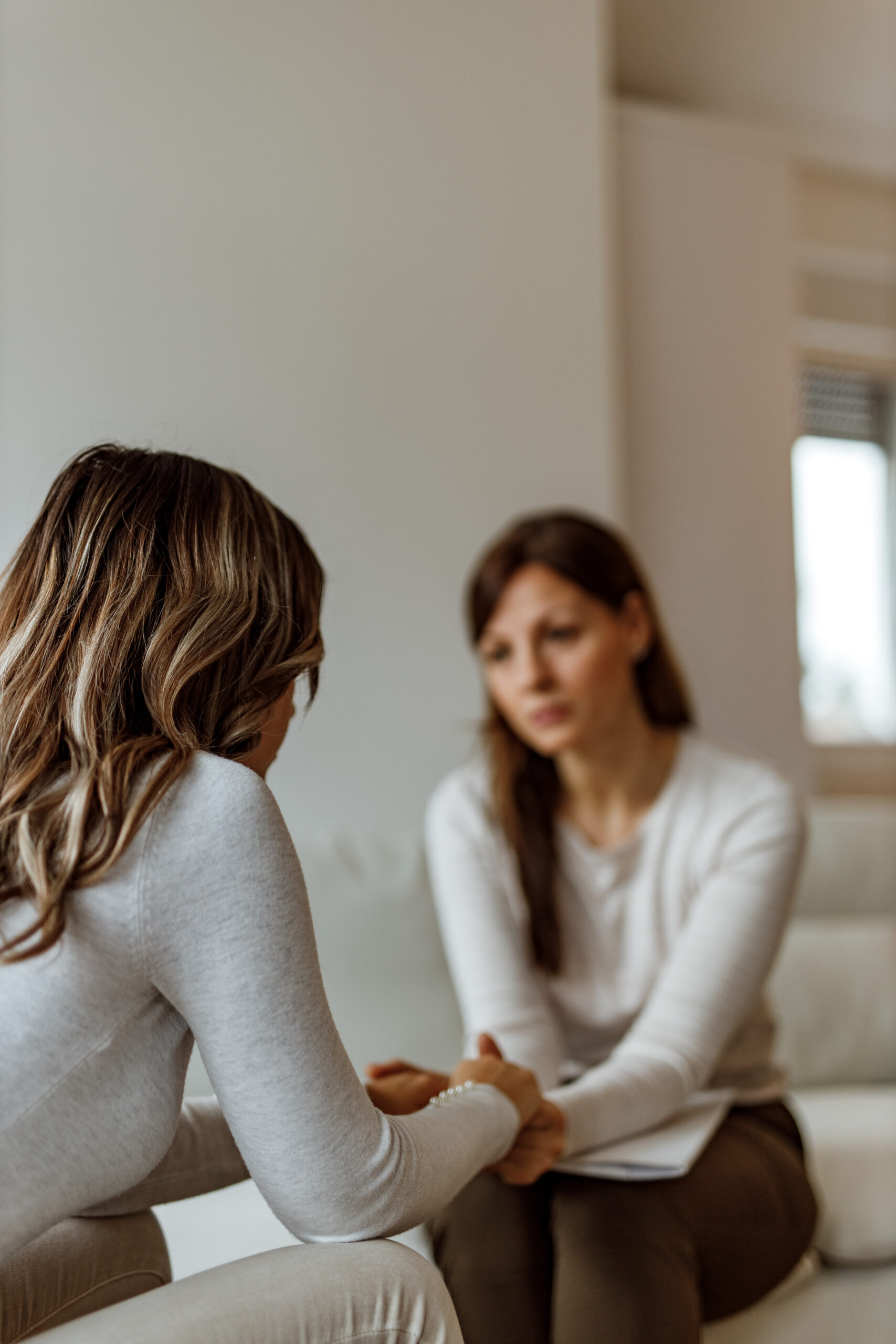Female patient speaking with therapist during drug rehab in New Jersey